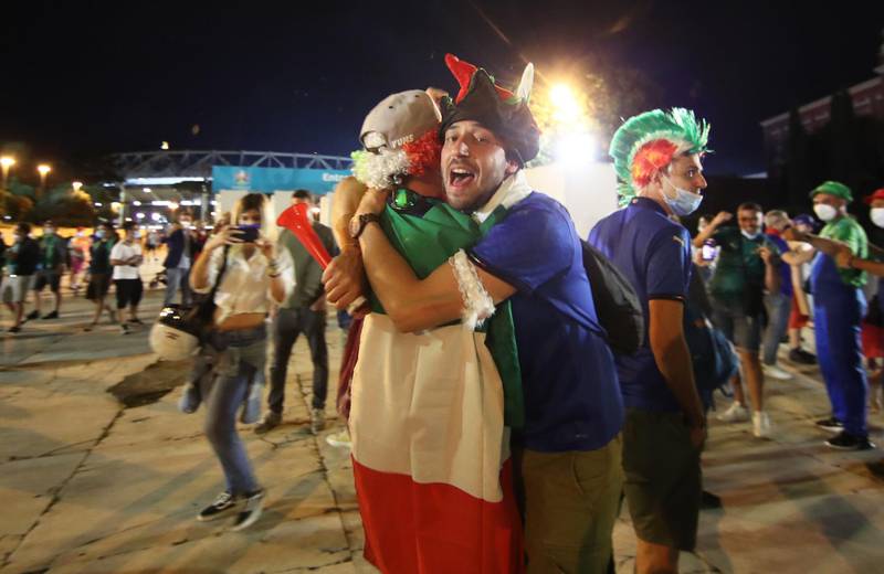Italy fans celebrate after the match in Rome. Reuters
