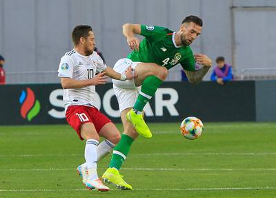 Ireland's Shane Duffy, right, fights for the ball with Jano Ananidze of Georgia. AP
