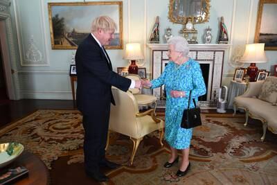 The queen welcomes Mr Johnson as the newly elected leader of the Conservative Party, during an audience in July 2019. Getty Images