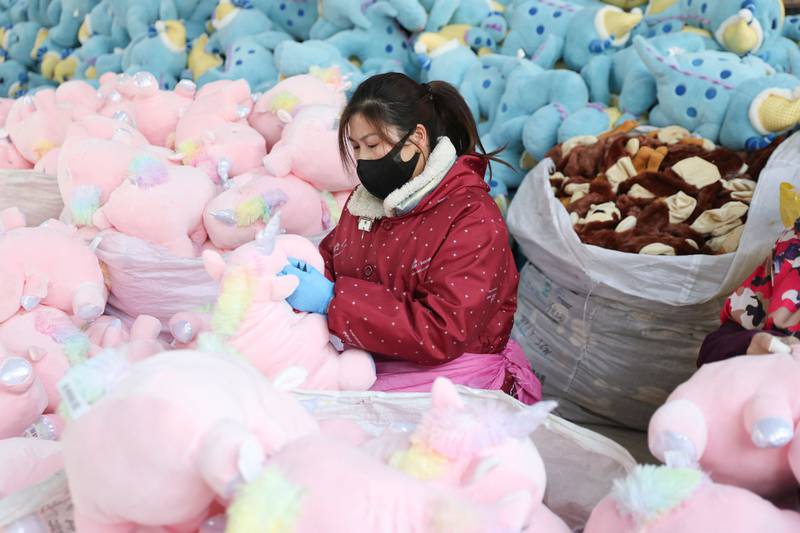 A woman producing stuffed toys at a factory in Lianyungang, in China's eastern Jiangsu province. AFP