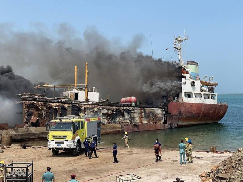 Crews tackle a fire on a vessel in the Rafa port area of Umm Al Quwain. Photo: UAQ Civil Defence