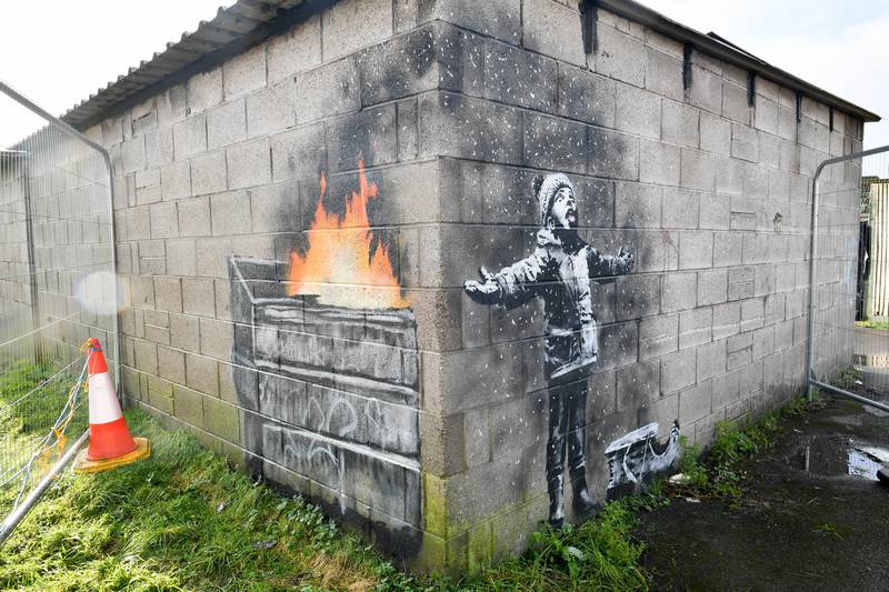 Banksy's 'Season's Greetings' appeared on a steelworker's private garage in Port Talbot in 2018.  The mural is to be removed from its home in Wales and taken to a secure location after attempts by fanatics to damage the artwork. All photos: PA