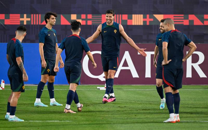 Portugal defender Ruben Dias training with teammates. AFP