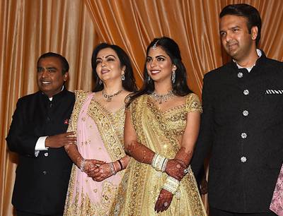 The Ambanis with the new couple.