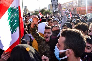 Anti-government protesters chant slogans during a demonstration in the centre of Lebanon's impoverished northern port city of Tripoli on January 31, 2021. AFP 