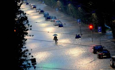General view of a flooded street in Milan, Italy, 15 November 2014. Storms in northern Italy unleash chaos on the region, leaving five dead. The damage from floods and landslides has been estimated at more than 100 million euros. Daniele Mascolo / EPA