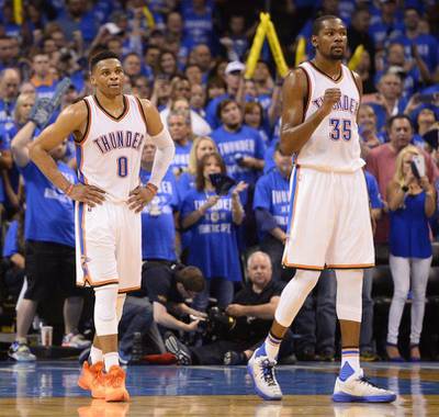 Oklahoma City Thunder players Kevin Durant, right, and Russell Westbrook react during their Game 6 win over the San Antonio Spurs in the NBA play-offs on Thursday night. Larry W Smith / EPA / May 12, 2016  