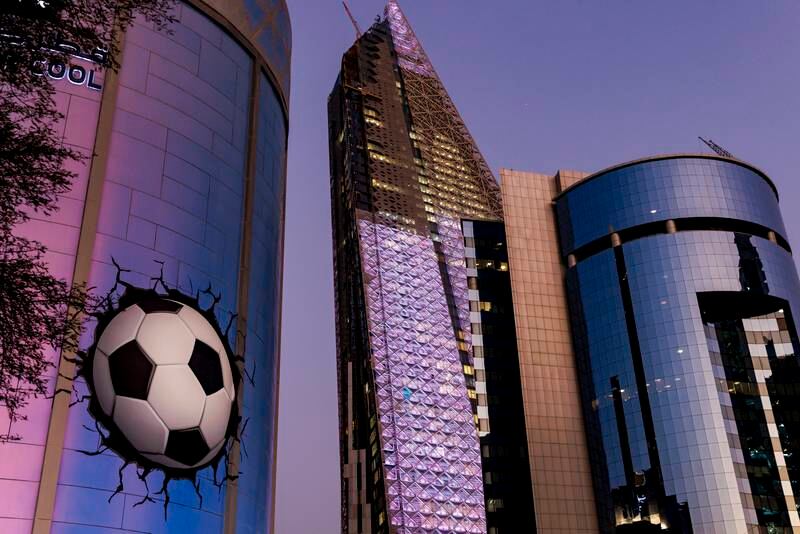 A building in Doha displays an animation of a football on its facade. Getty