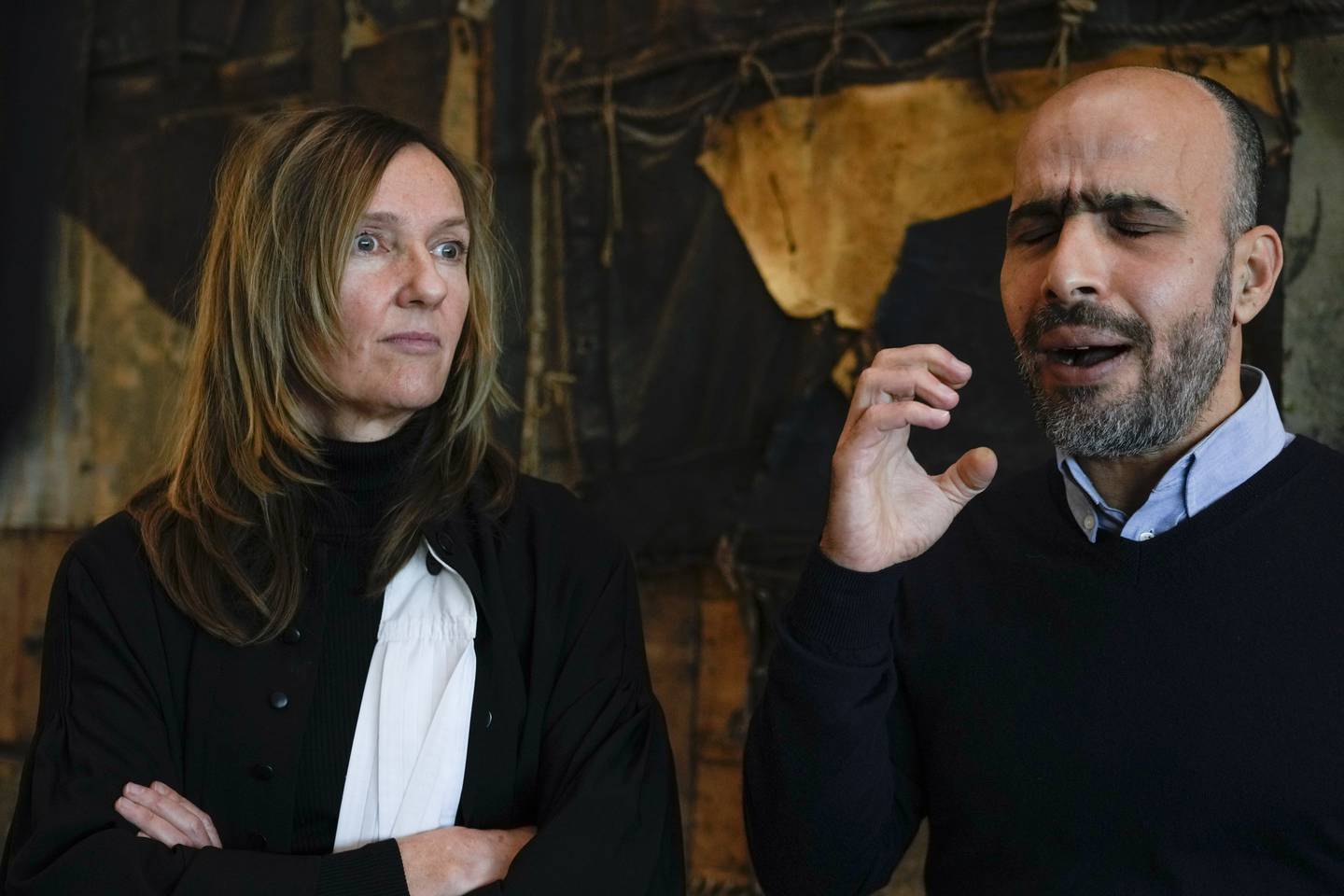 Plaintiff Ismail Ziada, right, and his lawyer Liesbeth Zegveld, after the Dutch appeals court ruling. AP