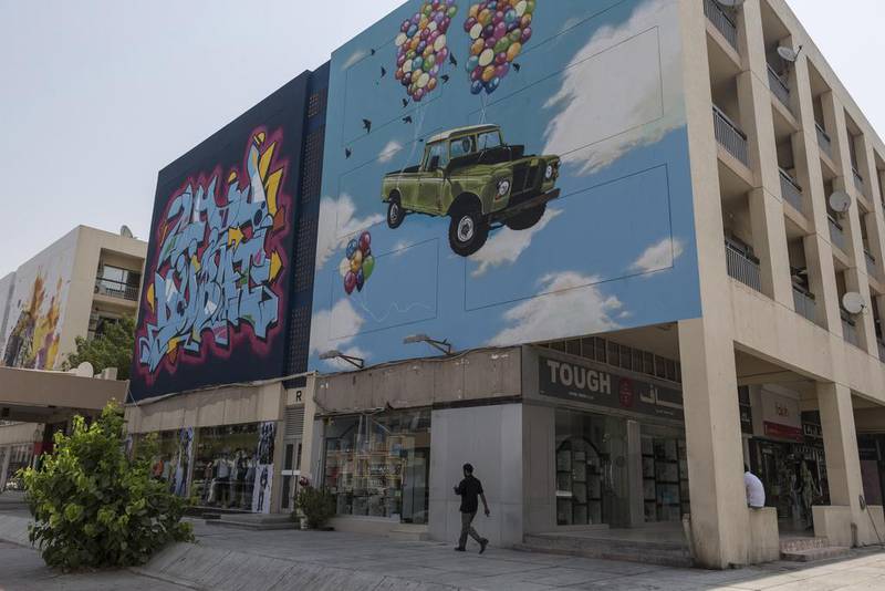 Eight street artists have helped give the area a facelift by painting 24 huge murals on the side of 12 apartment buildings and shops around the Karama shopping complex. Antonie Robertson / The National