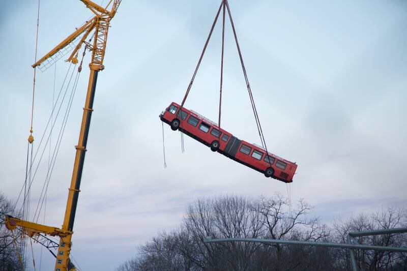 A crane lifts a bus from a ravine after the Fern Hollow Bridge in Pittsburgh, Pennsylvania, US, collapsed. Several vehicles were on the bridge when it fell and 10 people were injured. Reuters