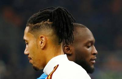 Soccer Football - Serie A - Inter Milan v AS Roma - San Siro, Milan, Italy - December 6, 2019   AS Roma's Chris Smalling and Inter Milan's Romelu Lukaku before the match    REUTERS/Alessandro Garofalo     TPX IMAGES OF THE DAY