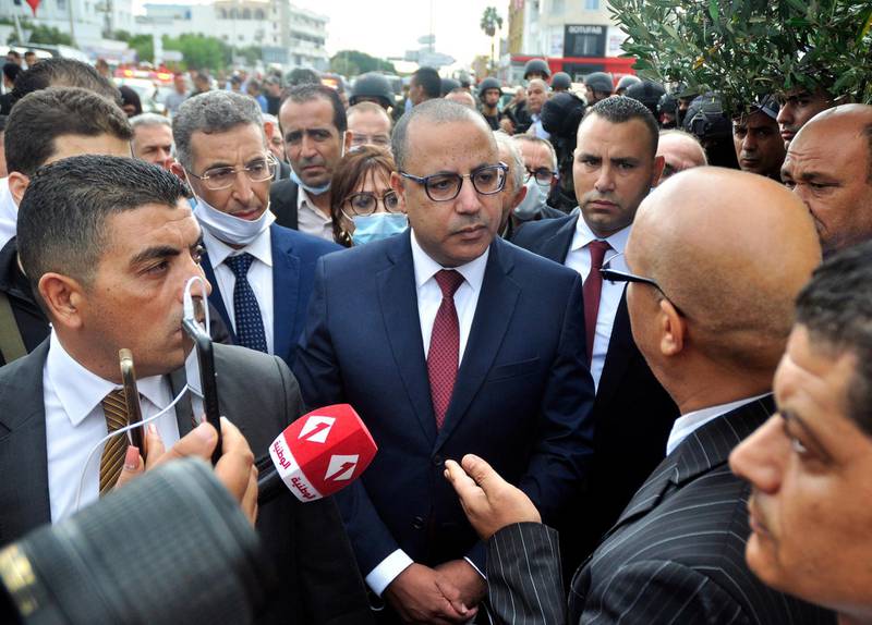 epa08650532 Tunisian Prime Minister Hichem Mechichi  speaks to media at  the site of an attack on Tunisian National Guard officers in Sousse, south of Tunis,Tunisia, 06 September 2020. According to The Tunisian National Guard three assailants were shot dead and one arrested after they ran over a National Guard checkpoint with their car. The attackers killed at least one police officer and wounded another using knives.  EPA/STR