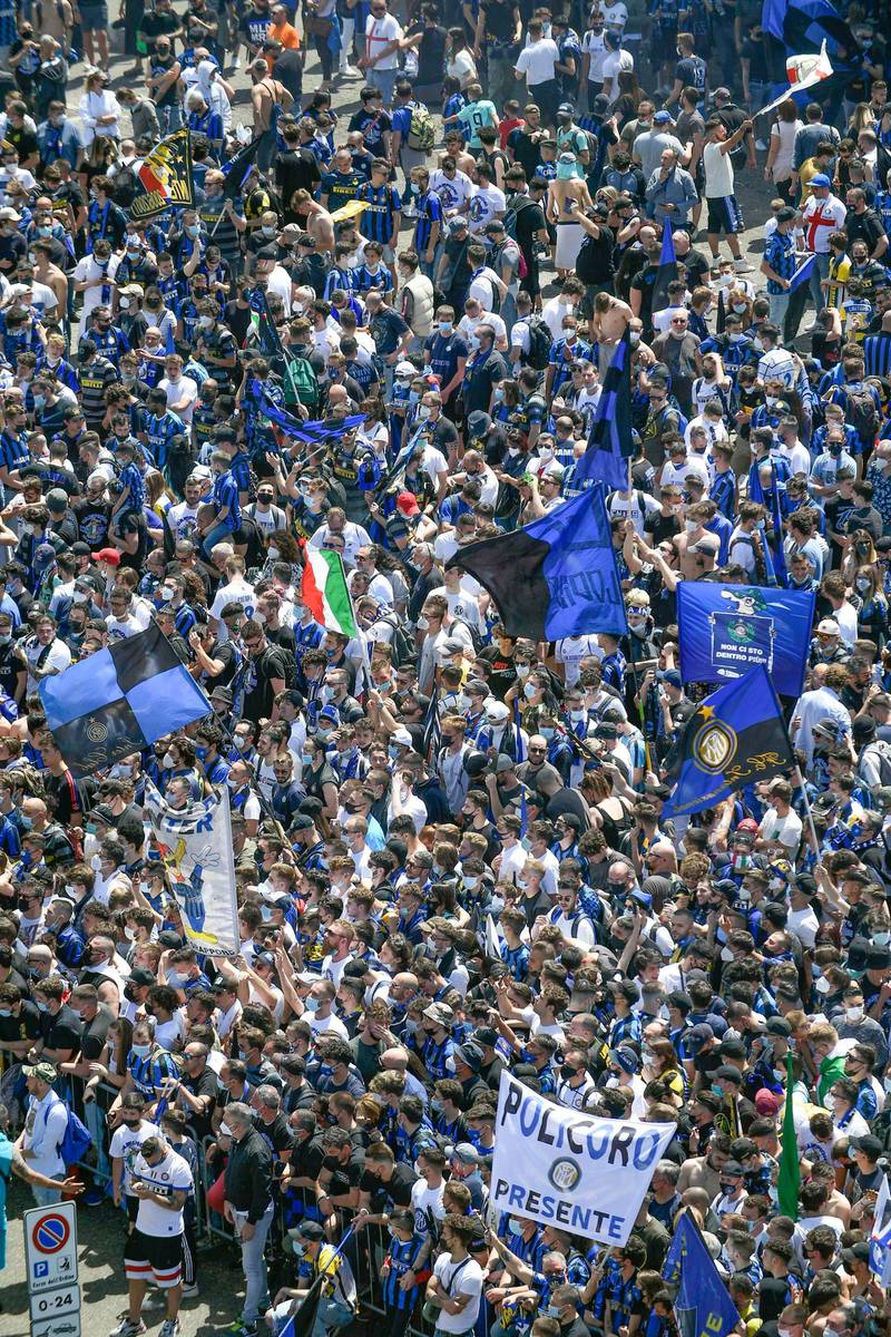Inter supporters celebrate outside the San Siro before the match. EPA