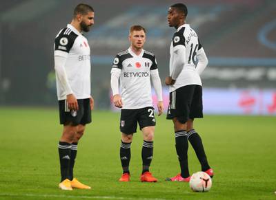 Harrison Reed of Fulham stands with Tosin Adarabioyo and Aleksandar Mitrovic. Getty