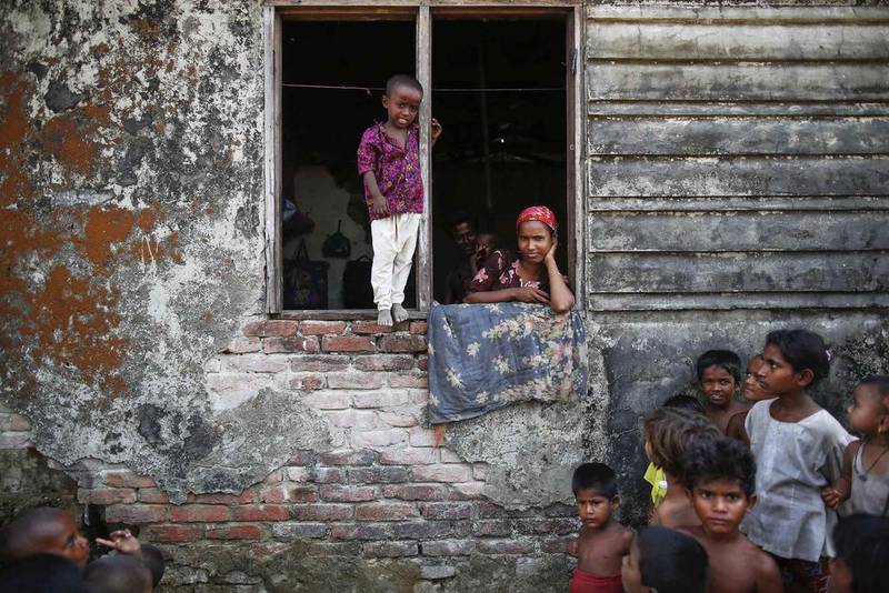 Rohingya Muslims displaced by violence pass the time at a former rubber factory serving as their shelter near Sittwe. Damir Sagolj / Reuters