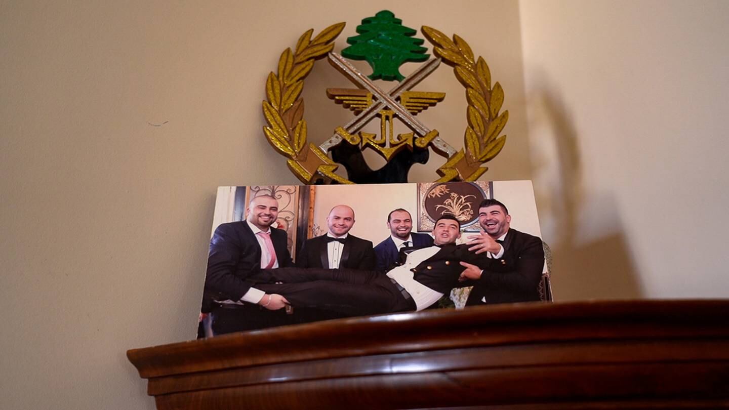 A photo in the Assaii house shows Abdallah, far right. Finbar Anderson/ The National