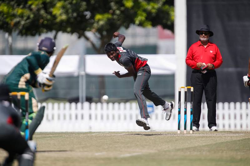 DUBAI, UNITED ARAB EMIRATES, OCTOBER 25, 2014. Manjula Guruge UAE (red and Gray) bowling against Pakistan A (Green) at the ICC Oval in Sports City. (Photo: Antonie Robertson/The National) Journalist: Paul Radley. Section: Sport.