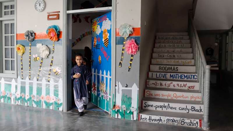 Minahil, a pupil at Khushal School and College, finishes her class.
