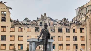 The statue of architect Alexei Beketov in front of a damaged building of the Kharkiv National University of Urban Economy following a missile strike in Kharkiv, northeastern Ukraine. An IMF agreement will help the country restore financial stability to its economy and rebuild. EPA
