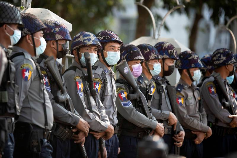 Police stand guard as they wait for more protests against the military coup in Yangon, Myanmar. Reuters