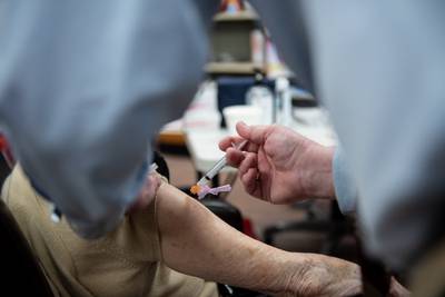 A pharmacist administers a Covid-19 vaccine in Alabama, US, where anti-vaccine sentiment is rife. Bloomberg