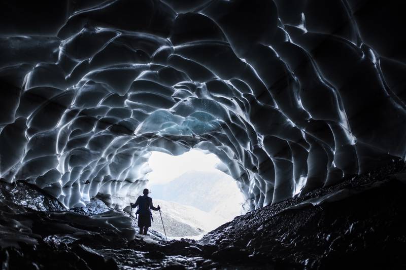A man investigates a cave at the Sardona glacier, in Vaettis, Switzerland. AP