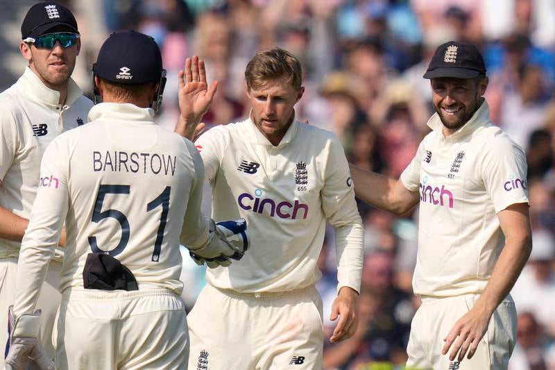 England captain Joe Root, centre, celebrates taking the wicket of India's Shardul Thakur for 60. AP