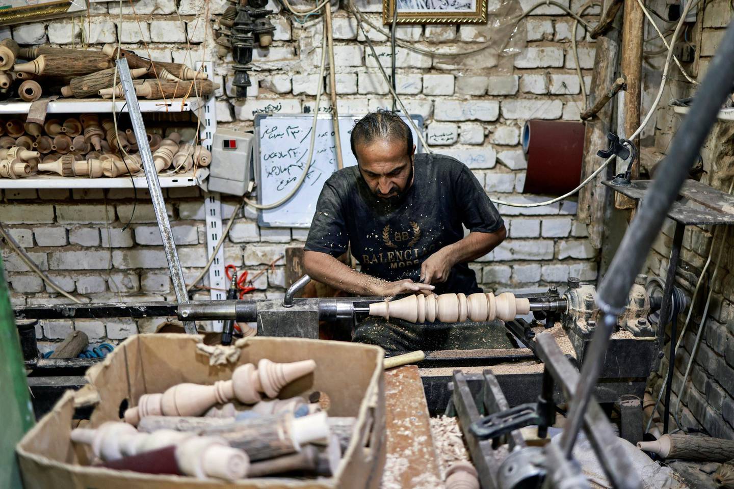 A worker makes a hookah, traditionally water-pipe made out of wood, in his workshop in Kerbala, Iraq, June 11, 2021. Picture taken June 11, 2021. REUTERS/Abdullah Dhiaa al-Deen