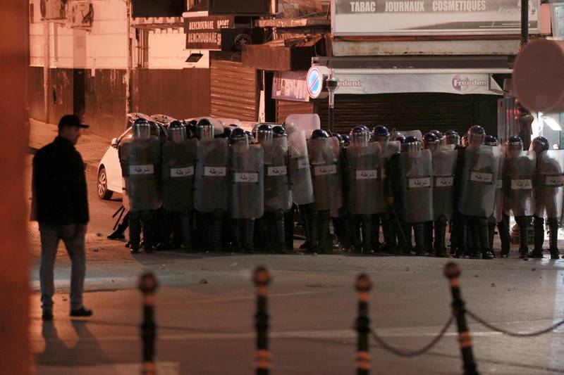 Riot police officers gather in Algiers after the presidential elections. Algerians — without a leader since April — voted for a new president or boycotted and held street protests against the elections decried by a massive pro-democracy movement that forced former leader Abdelaziz Bouteflika to resign. AP