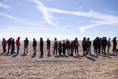 Arrivals line up after being helped ashore in Dungeness. Getty Images