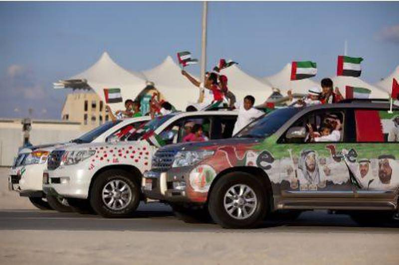 People join in celebration and show off their decorated cars during the Spirit of Union Parade at Yas Island in 2011. Silvia Razgova/The National