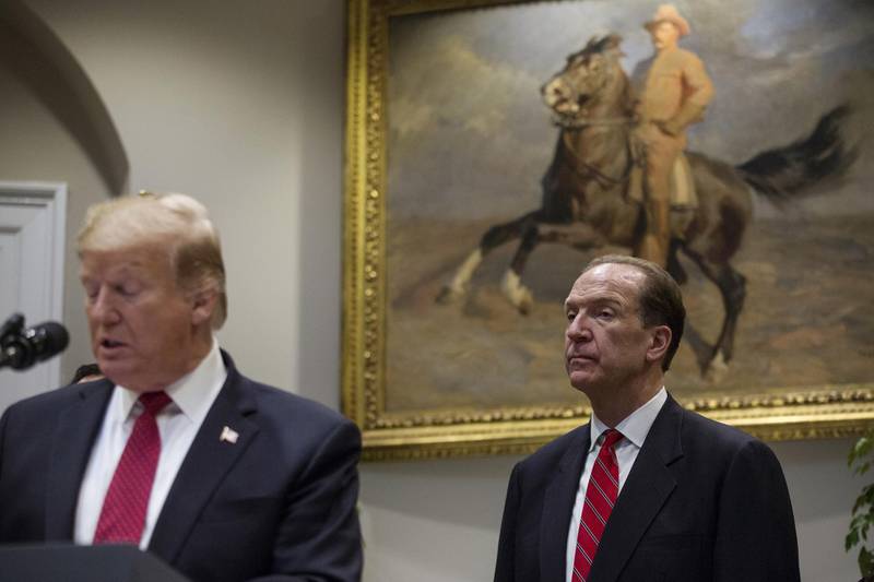 David Malpass, World Bank president nominee for U.S. President Donald Trump, right, listens while Trump speaks in the Roosevelt Room of the White House in Washington, D.C., U.S., on Wednesday, Feb. 6, 2019. Trump nominated senior Treasury official Malpass to lead the World Bank, choosing a loyalist who has been sharply critical of China and has called for a shakeup of the global economic order. Photographer: Zach Gibson/Bloomberg