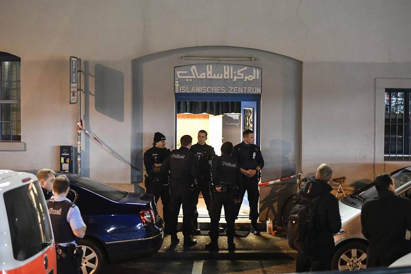 Police secure the area in front of a Muslim prayer hall in Zurich where a gunman reportedly wounded three people on December 19, 2016. Ennio Leanza/Keystone via AP