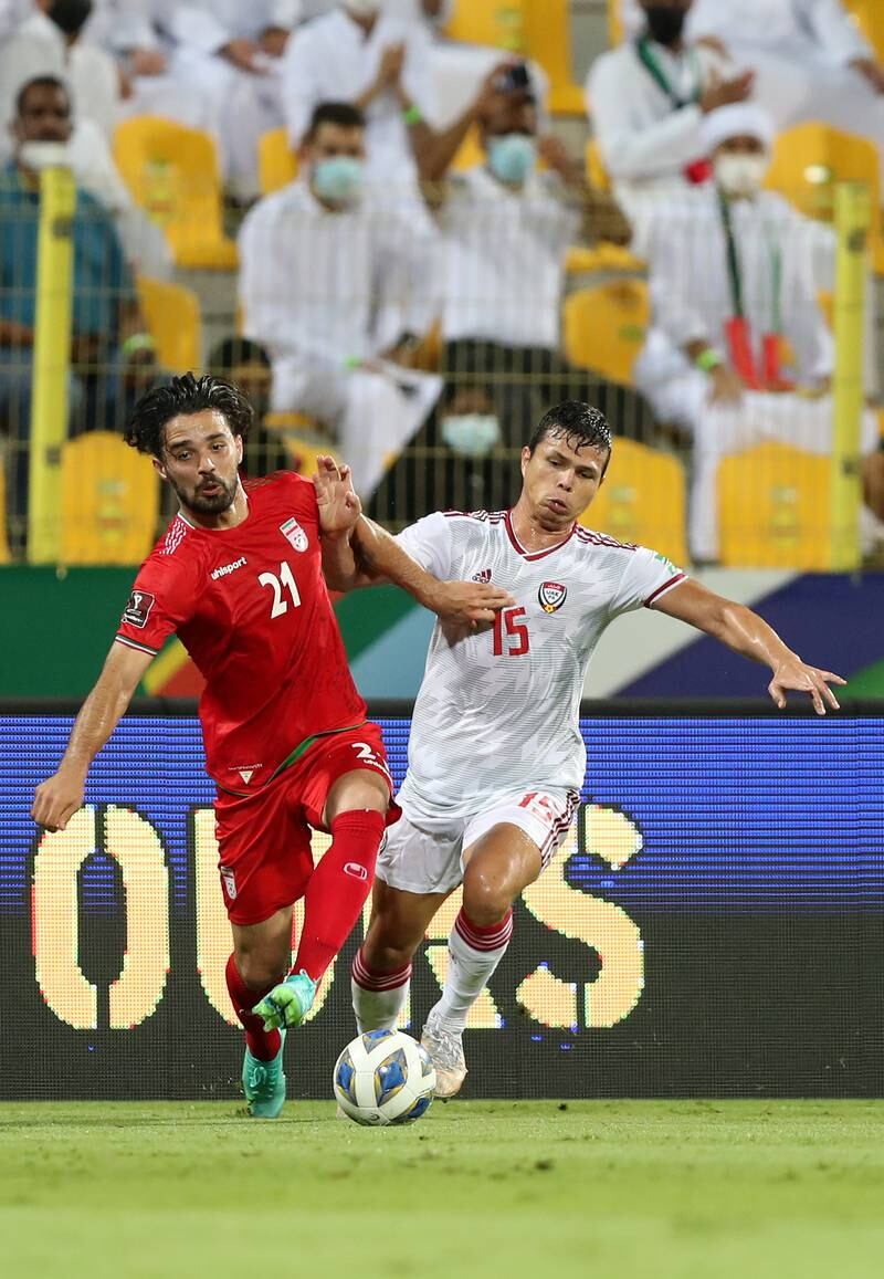 UAE's Fabio De Lima battles for possession with Omid Noorafkan of Iran. Chris Whiteoak / The National
