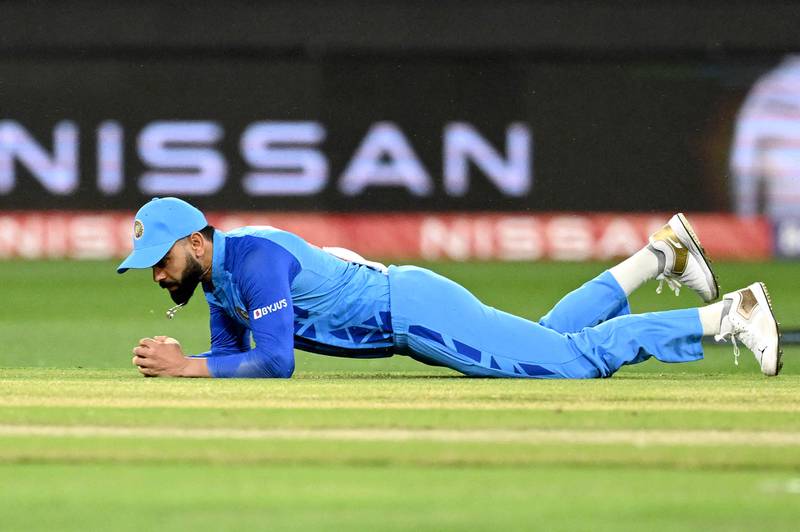 India's Virat Kohli takes a catch to dismiss Zimbabwe's Wessly Madhevere. AFP