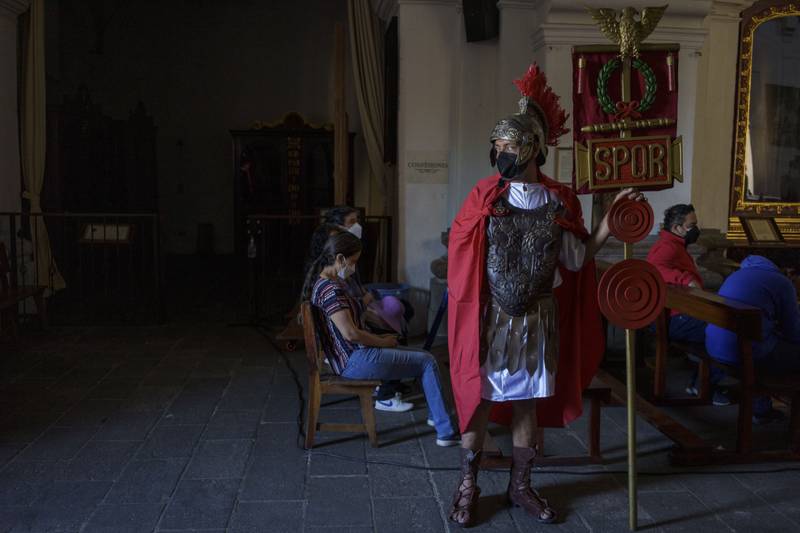 A parishioner waits to take part in a Holy Thursday procession in Antigua, Guatemala. AP Photo
