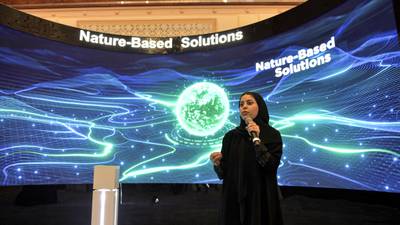 A Saudi host addressing guests during a presentation on the Saudi Green Initiative earlier in July, which includes goals for tree-planting and reducing emissions. AFP