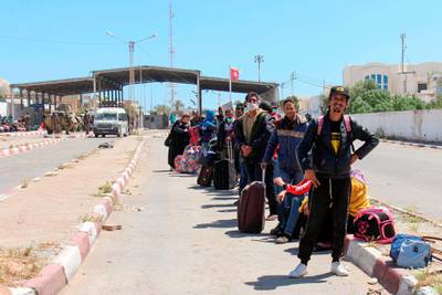 Tunisian workers stranded in Libya wait at the Ras Jedir border post to return to their country on April 21, 2020. AFP