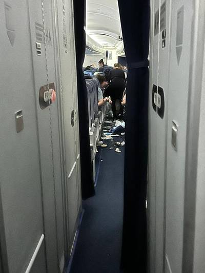 Food and other objects strewn on the floor after Flight 469, from Austin, Texas, to Frankfurt, hit heavy turbulence