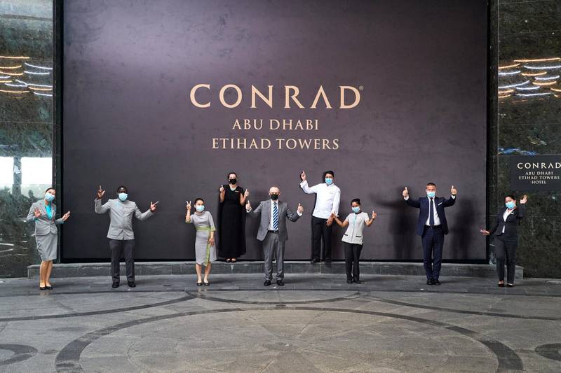 Staff celebrate the opening of Conrad Abu Dhabi Etihad Towers. Jonathan Gibbons