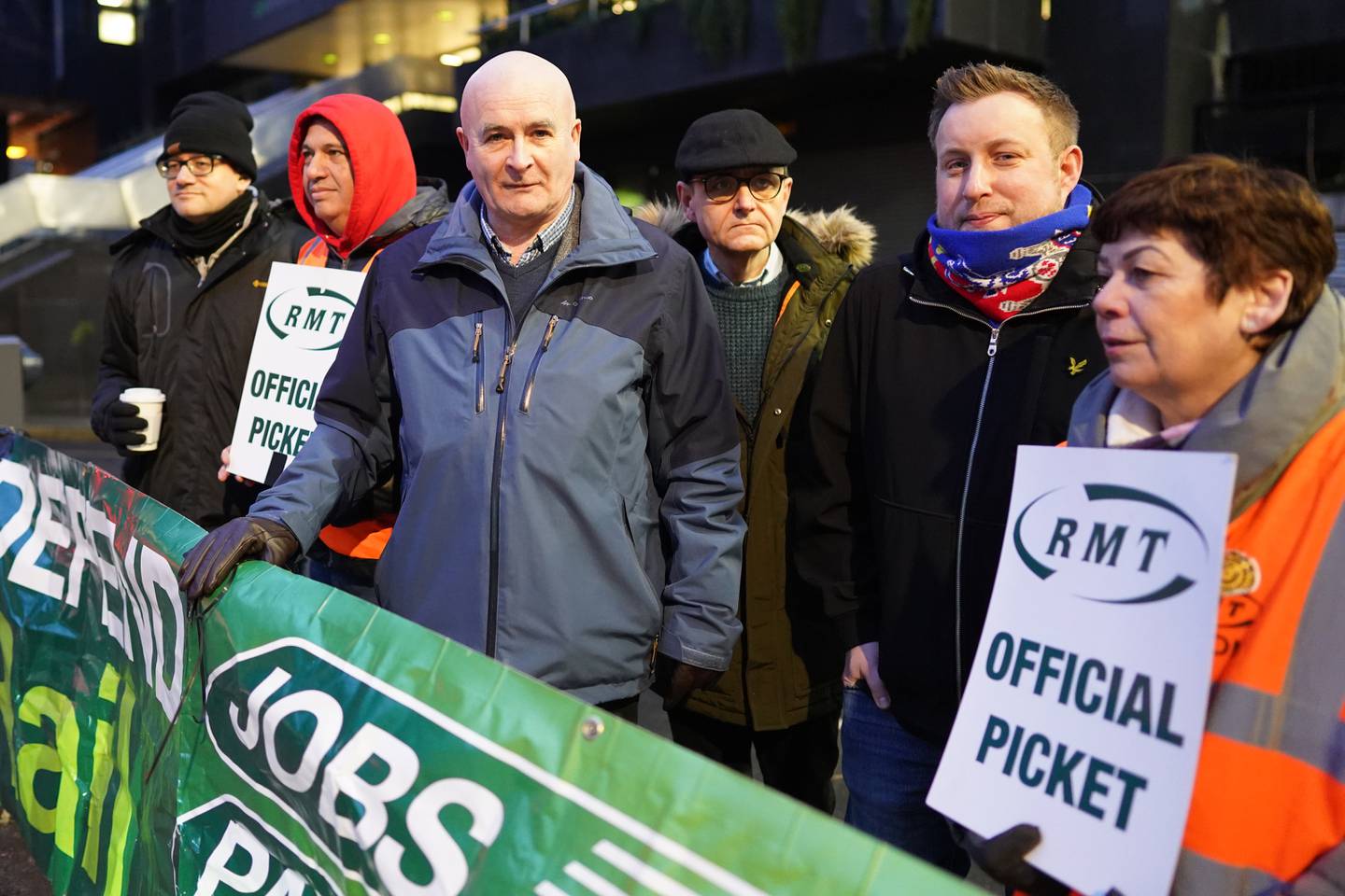 RMT boss Mick Lynch, third from left, on a picket line at London Euston station. PA 