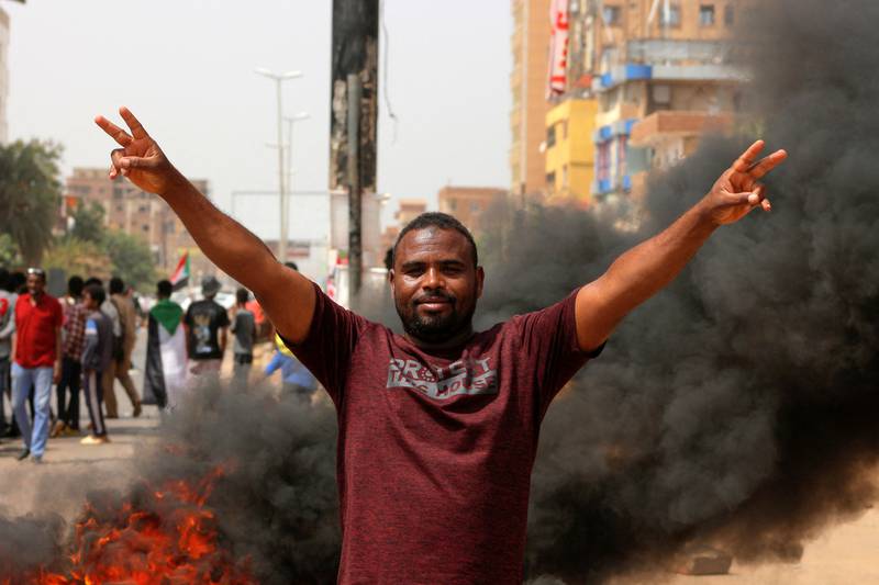 A Sudanese anti-military protester flashes the victory sign in the Sudanese capital, Khartoum. AFP