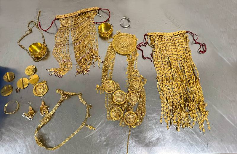 A passenger carrying nearly half a million dirhams' worth of gold in his luggage was arrested by Sharjah Police. Photo: Sharjah Police