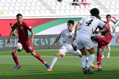 Almoez Ali shoots the score Qatar's opening goal. EPA