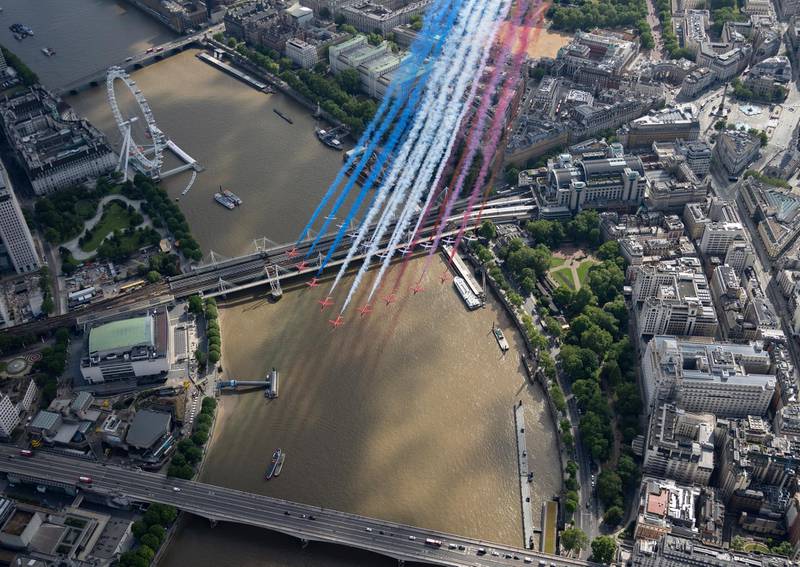 RAF's Red Arrows, flying alongside their French counterparts, La Patrouille de France over the River Thames, as French President Macron visits London. EPA
