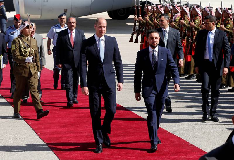 Britain's Prince William and Jordan's Crown Prince Hussein bin Abdullah II review the honour guard in Amman, Jordan, June 24, 2018. REUTERS/Muhammad Hamed