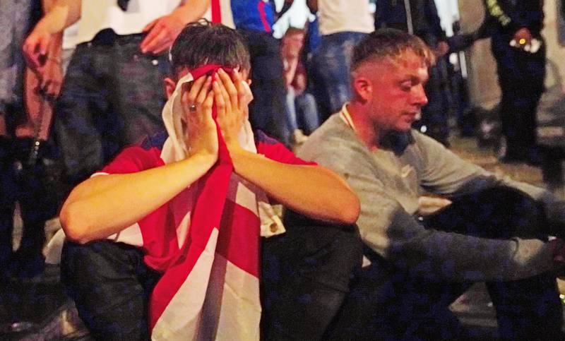 A dejected fan in London's Trafalgar Square after Italy won the Uefa Euro 2020 Final against England when the game was decided on penalties.