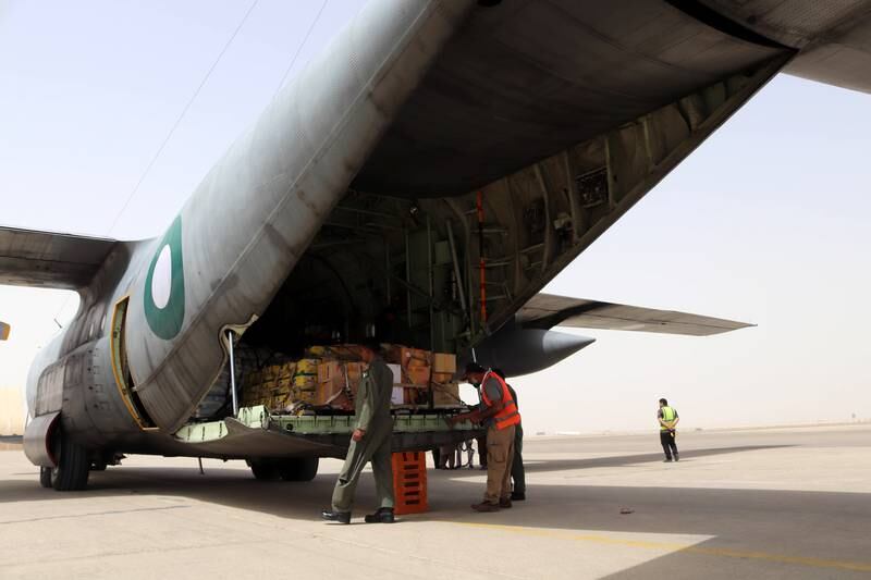 A Pakistan Air force C-130 aircraft delivers food and medical supplies donated by Pakistan, at Hamid Shah Baba International Airport in Kandahar, Afghanistan, on September 10, 2021. EPA