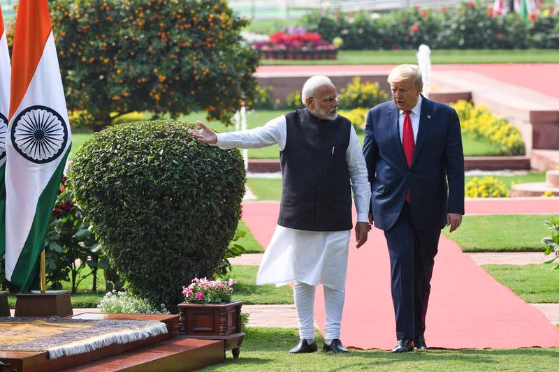 US President Donald Trump (R) and India's Prime Minister Narendra Modi arrive for a joint press conference at Hyderabad House in New Delhi.  AFP